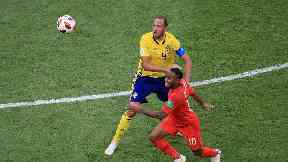 Sweden’s Andreas Granqvist (left) and England’s Raheem Sterling battle for the bal