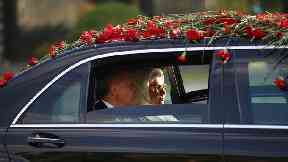 Turkey’s President Recep Tayyip Erdogan, accompanied by his wife Emine, arrives for a ceremony at the Presidential Palace in Ankara, Turkey