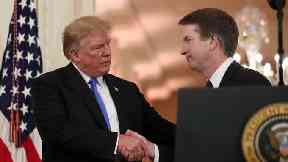 President Donald Trump shakes hands with Brett Kavanaugh, his Supreme Court nominee (Alex Brandon/AP)