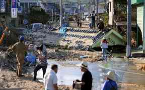 A roof of a house is left in the middle of a road in Kurashiki, Okayama prefecture, western Japan