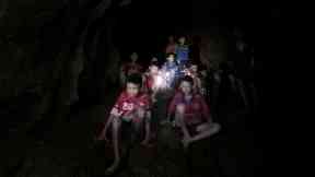 The boys and their coach as they were found in a partially flooded cave Thailand