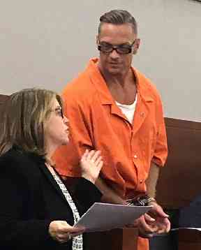Scott Raymond Dozier confers with a lawyer involved in his case, during an appearance in Clark County District Court in Las Vegas