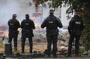 Police at the site of a Bonfire in the Bloomfield Avenue area of Belfast
