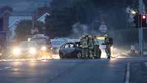Firefighters deal with a burnt out car in the Cherryhill area of Dundonald