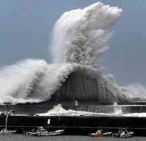 High waves hit breakwaters at the port of Aki
