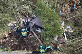 Police search for missing people at the site of a landslide after an earthquake in Atsuma town, Hokkaido