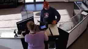 The man was caught on camera spectacularly failing to rob a store.