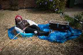 A Captain Jack Sparrow scarecrow is all at sea in a paddling pool