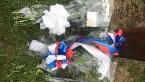 Tributes: Flowers were put down in memory of him.