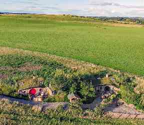 Aerial shot of the hobbit homes under the hill.