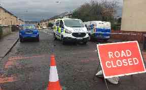 Officers are continuing inquiries at three properties and the street has been cordoned off.