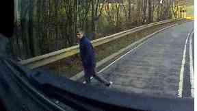 Dashcam: The man was struck by a lorry but managed to walk away.