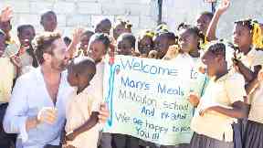 Haiti: Gerard Butler visited with Mary's Meals.