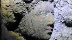 Stone: A detail of one of the figures found on the tomb.