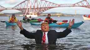 In too deep? One swimmer dressed as the US president.