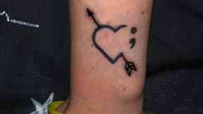 Tattoo: A semicolon shows solidarity against suicide, depression, addiction and other mental health issues.