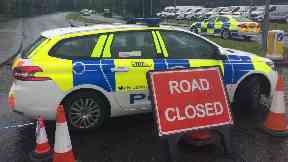 Police: Officers have closed the road.