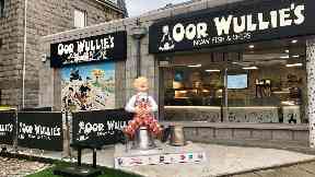 One of the statues has been placed outside the Oor Wullie chip shop in Aberdeen.