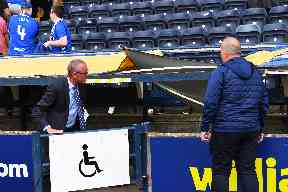 Disabled section: Officials assessing the damage caused.