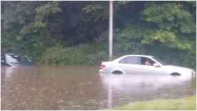 Flood: Car stuck near Edinburgh Airport.