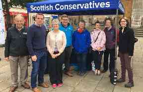 Campaigning: Ms Lax (far right) out with Moray MP Douglas Ross (second left).