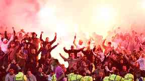 Flares: Smoke engulfed the pitch.