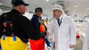 Boris Johnson joined in an auction at the fish market.