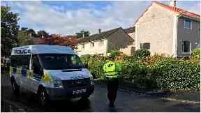 East Kilbride: Officers have closed the road.
