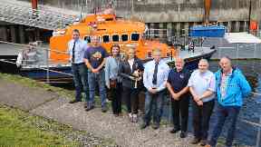 Celebration: Kerrie MacGillivray was handed the commemorative bell by RNLI Oban's volunteer lifeboat crew.