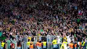 Celtic fans celebrate their last-minute win over Lazio.