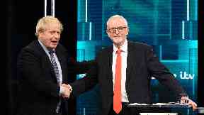 Leaders: Johnson and Corbyn shake hands during election showpiece.