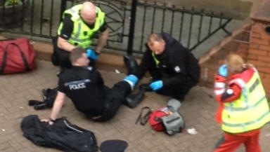 Knifeman Stabbed Police Officer As People Took Pictures